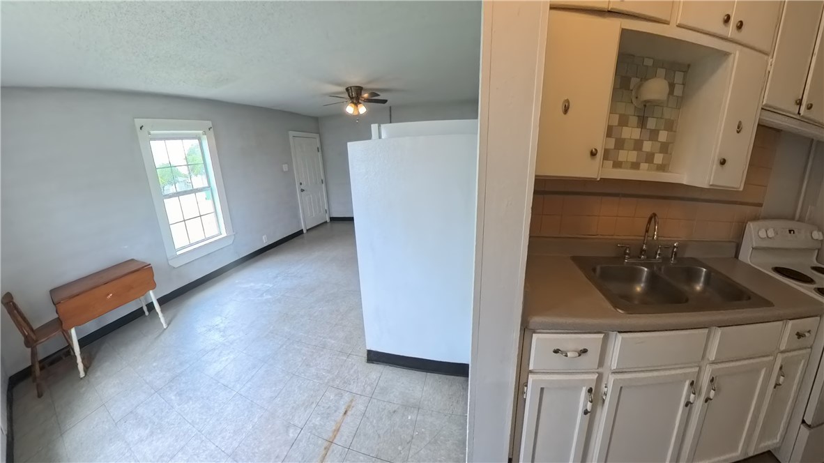 219 South 7th Street, Unit B Aransas Pass, TX 78336 - Photo 5 of 9 a bathroom with a sink and a mirror