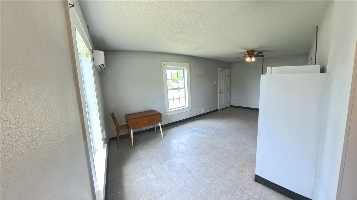 219 South 7th Street, Unit B Aransas Pass, TX 78336 - Photo 6 of 9 an entryway and livingroom with furniture