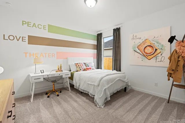 a bedroom with a bed and a window