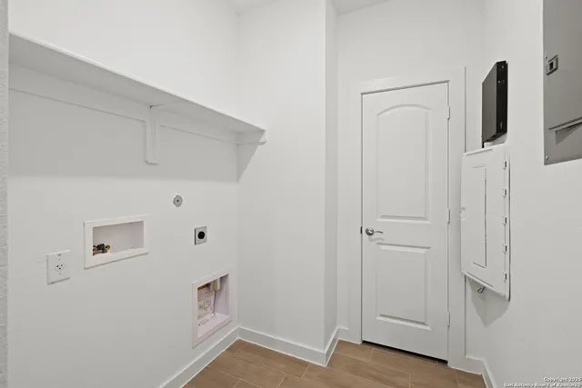 a view of storage and utility room with empty racks
