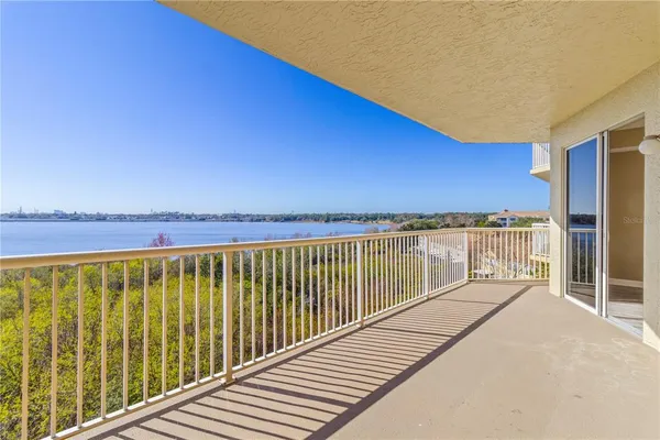 a view of a balcony with wooden floor