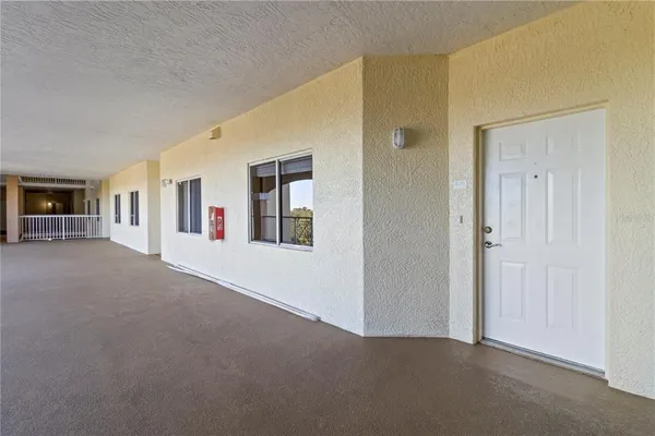 a view of a livingroom with an empty space and a fireplace