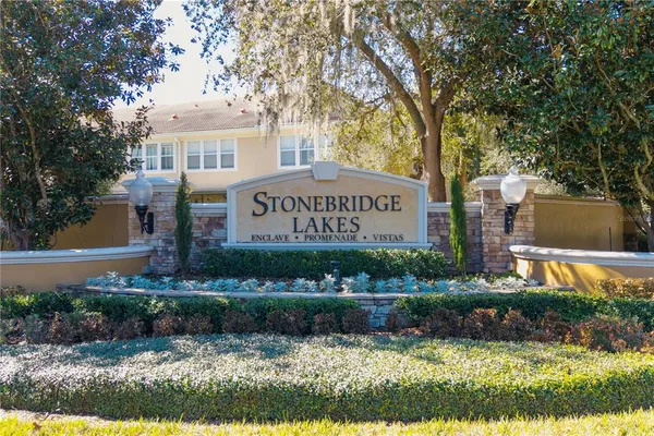 a front view of a house with a yard and outdoor seating