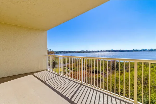 a view of balcony with wooden floor