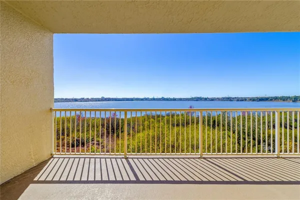 a view of a balcony with a floor to ceiling window