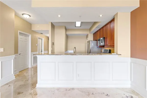 a bathroom with a sink a mirror and a vanity