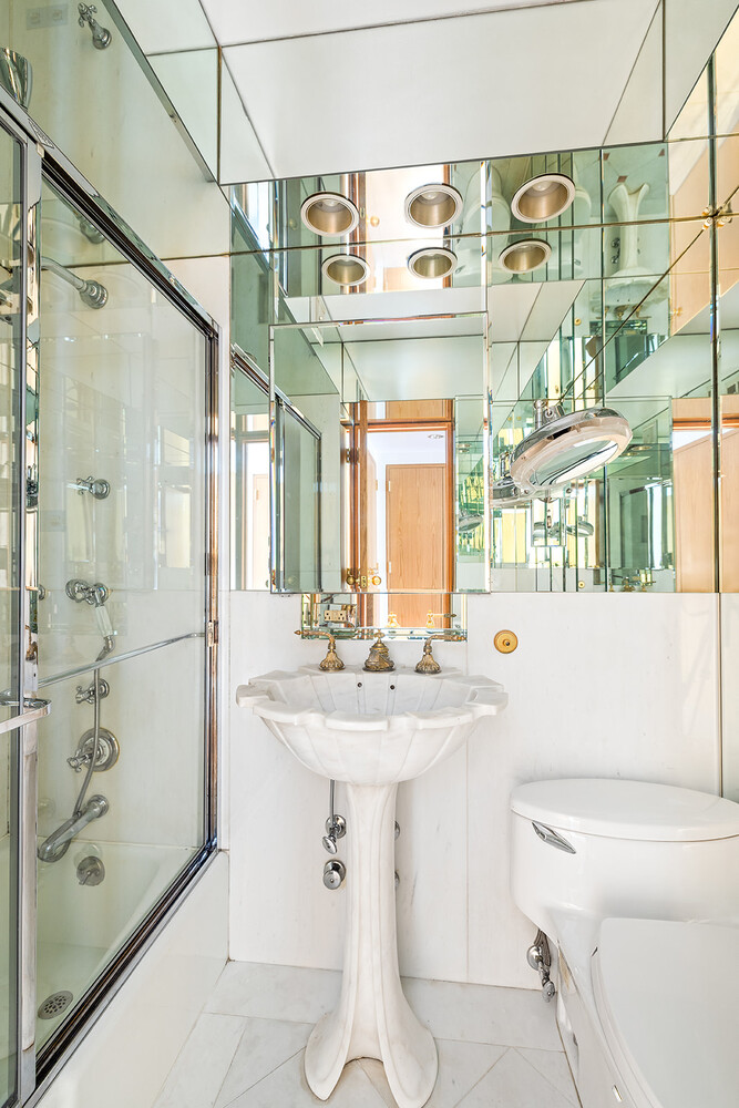 120 Central Park South, Unit 6AB Manhattan, NY 10019 - Photo 7 of 10 a bathroom with a sink a toilet and shower