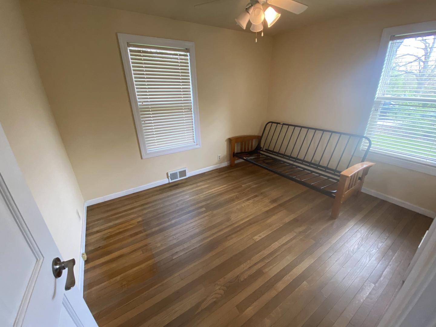 11270 Bell Road Lemont, IL 60439 - Photo 6 of 23 a view of an empty room with wooden floor and a window
