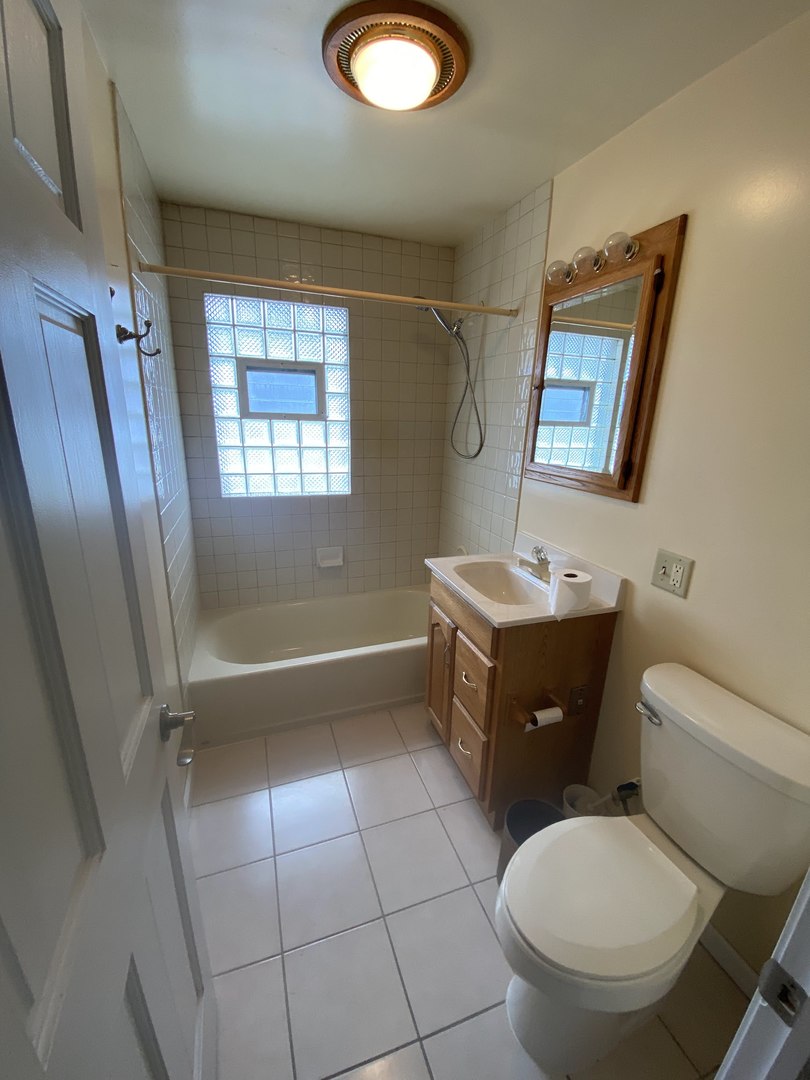 11270 Bell Road Lemont, IL 60439 - Photo 8 of 23 a bathroom with a granite countertop toilet sink and mirror