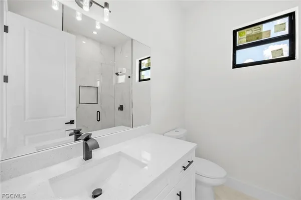 a bathroom with a sink a toilet and a tub