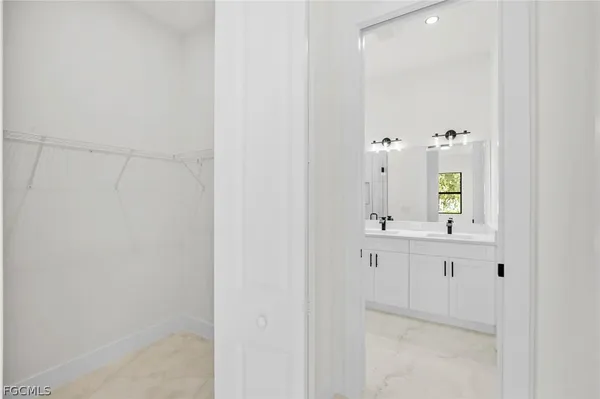 a bathroom with a sink vanity and mirror