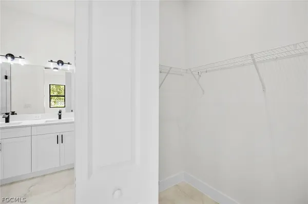 a bathroom with a shower and a sink