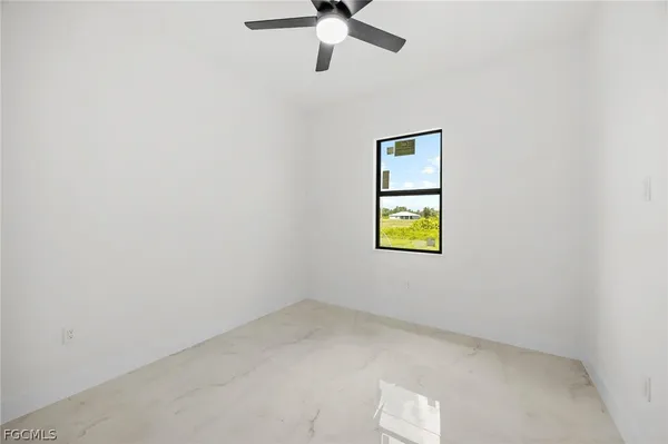 an empty room with window and windows