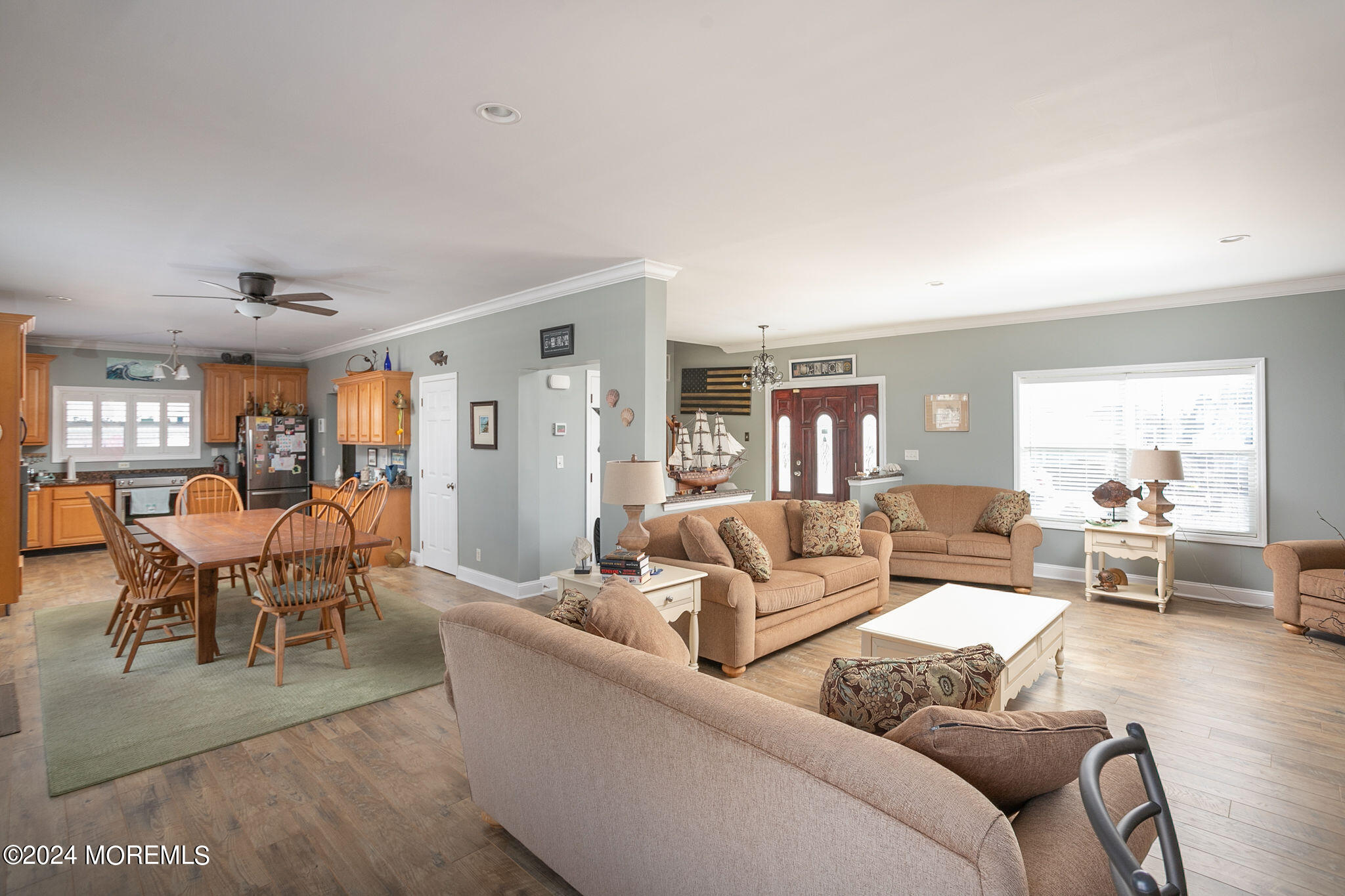 27 Sands Point Road Waretown, NJ 08758 - Photo 13 of 36 a living room with furniture wooden floor and a large window