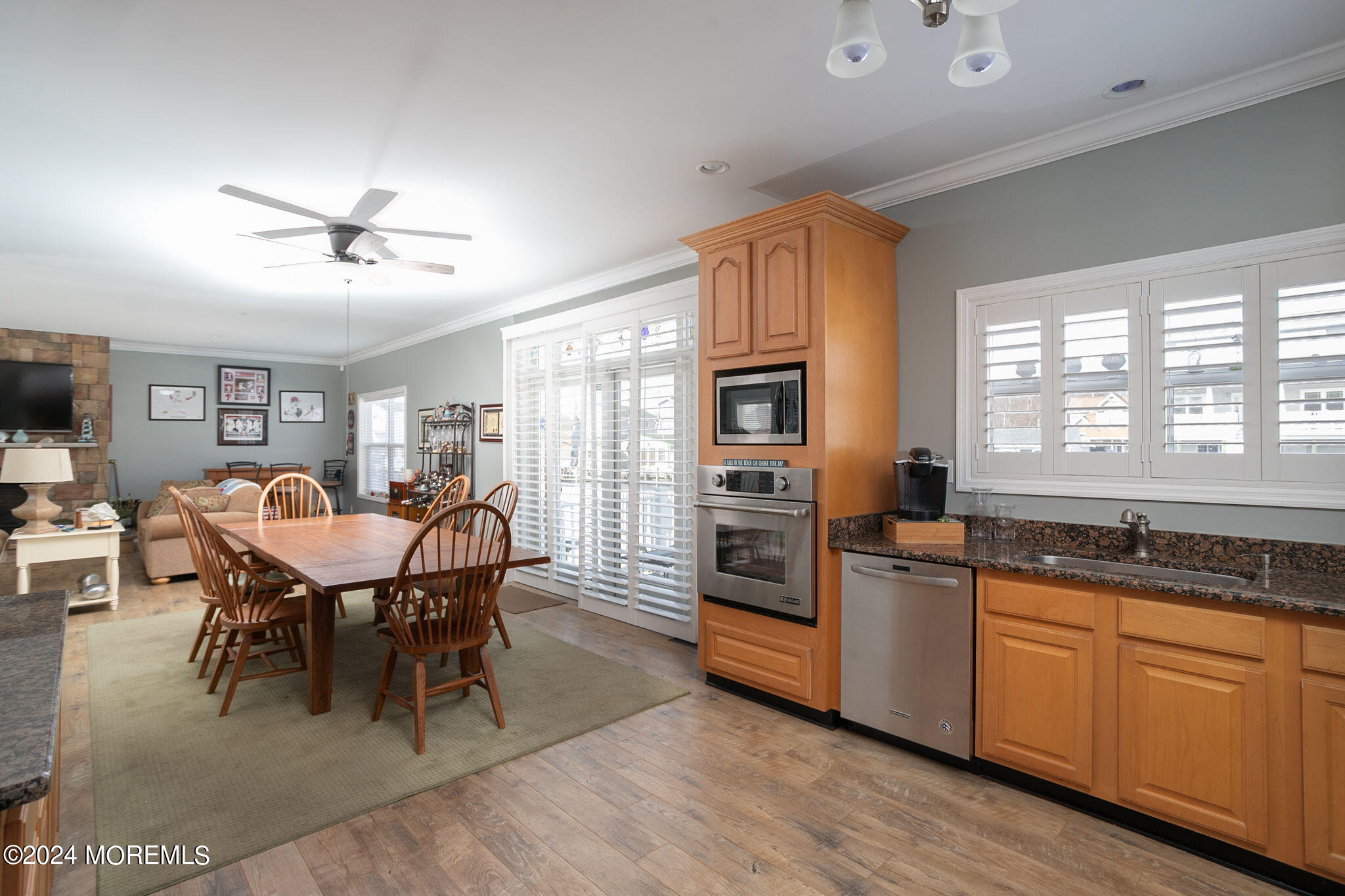 27 Sands Point Road Waretown, NJ 08758 - Photo 17 of 36 a kitchen with stainless steel appliances granite countertop a stove a refrigerator a kitchen island a sink cabinets and wooden floor