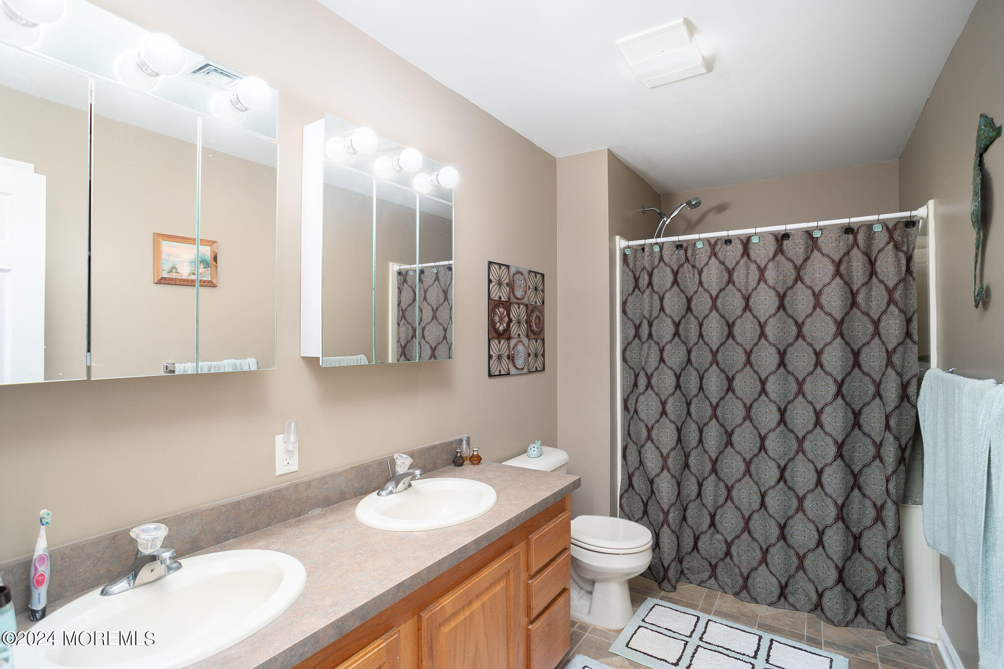 27 Sands Point Road Waretown, NJ 08758 - Photo 23 of 36 a bathroom with a sink and a mirror