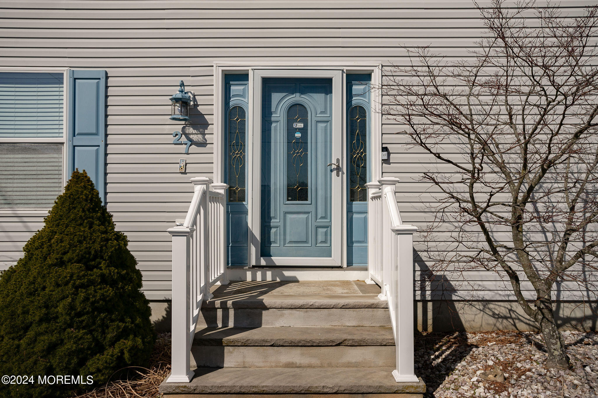 27 Sands Point Road Waretown, NJ 08758 - Photo 7 of 36 a front view of a house with a garden