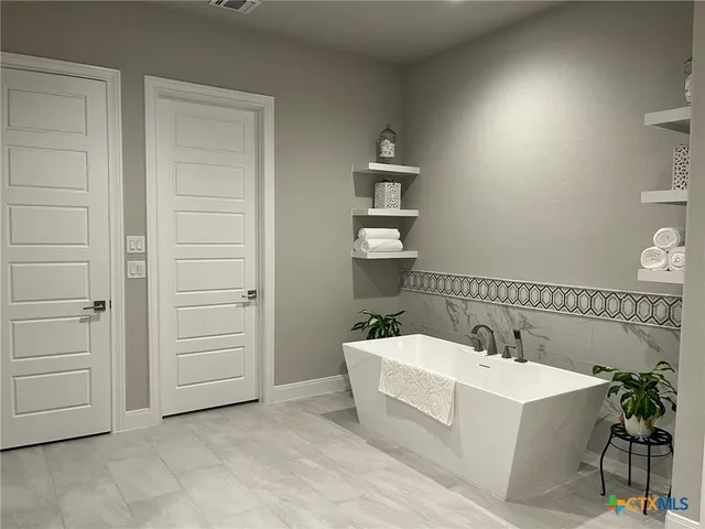 a bathroom with a sink and a bathtub