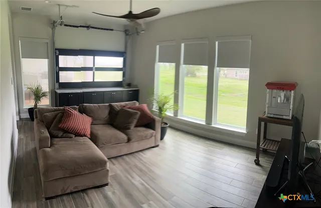 a living room with furniture and a window