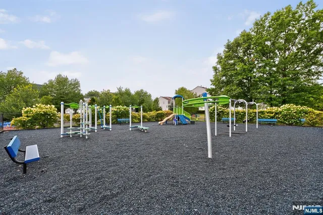 a view of a backyard with tables and chairs