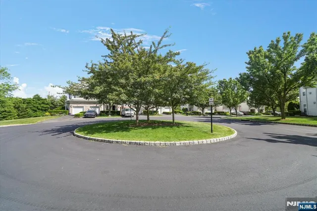 a view of a swimming pool with a yard