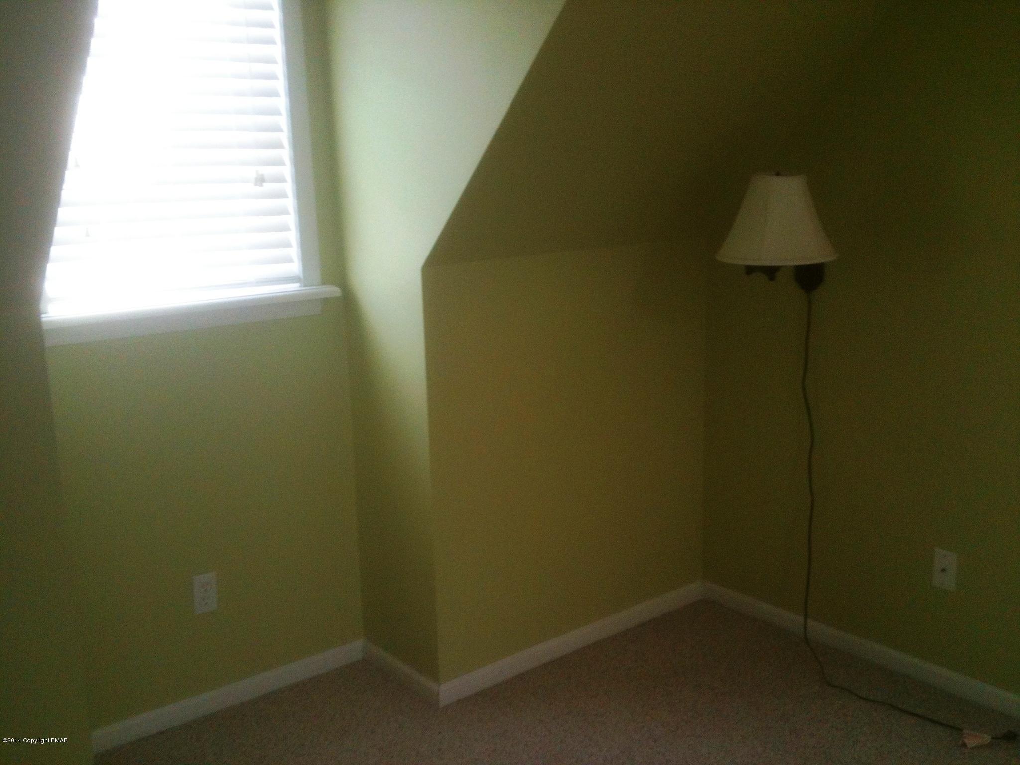 26 Lily Road East Stroudsburg, PA 18302 - Photo 2 of 48 an empty room with a window