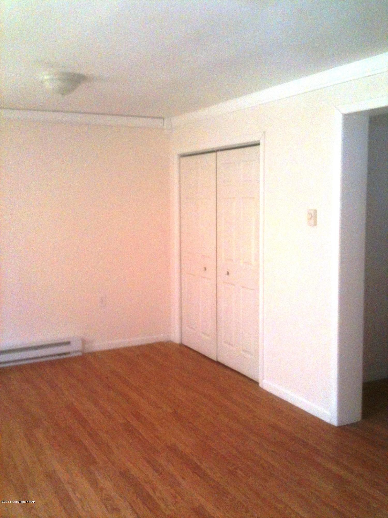 26 Lily Road East Stroudsburg, PA 18302 - Photo 30 of 48 a view of an empty room with wooden floor