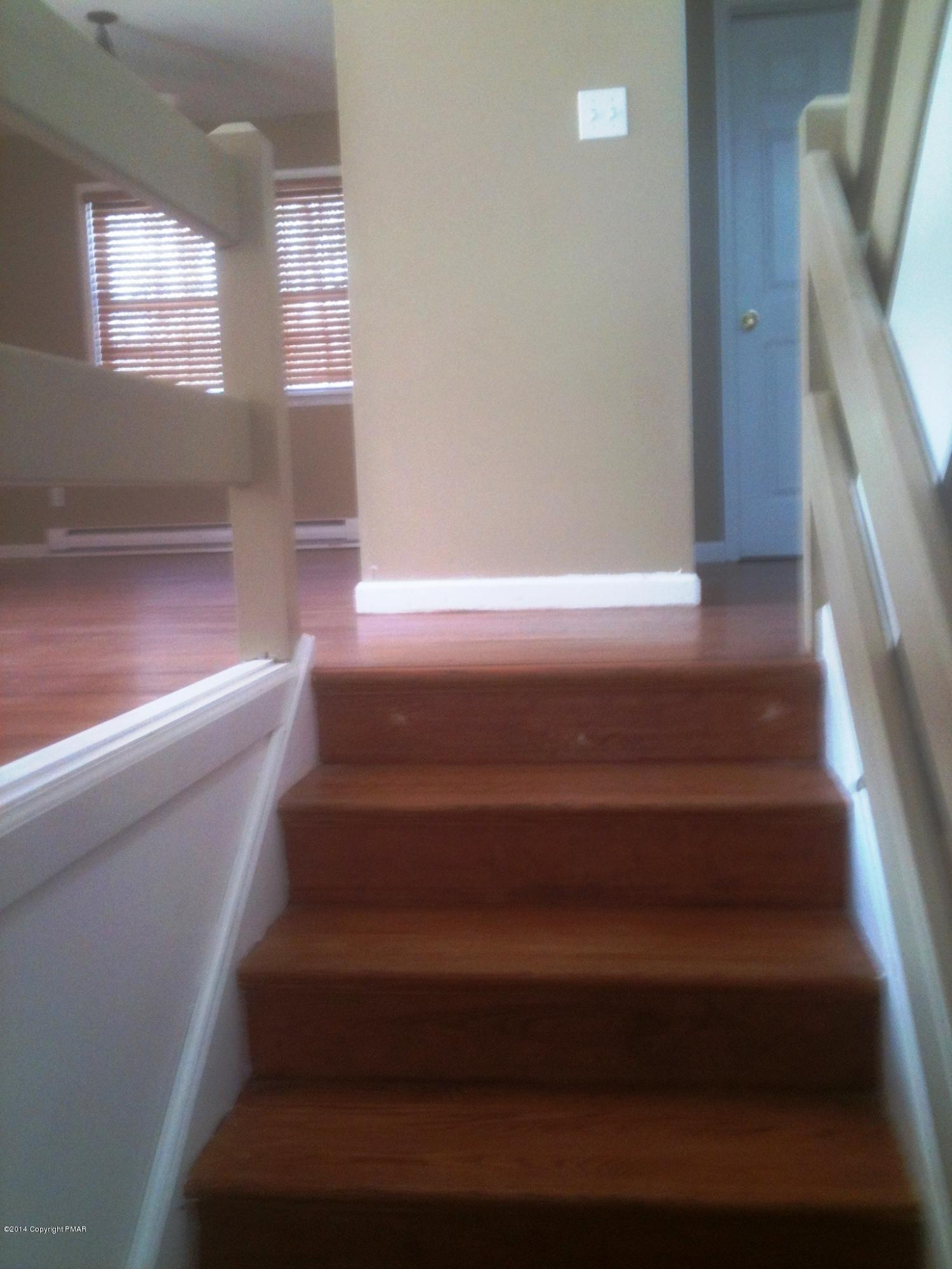 26 Lily Road East Stroudsburg, PA 18302 - Photo 32 of 48 a view of staircase with white walls and a window