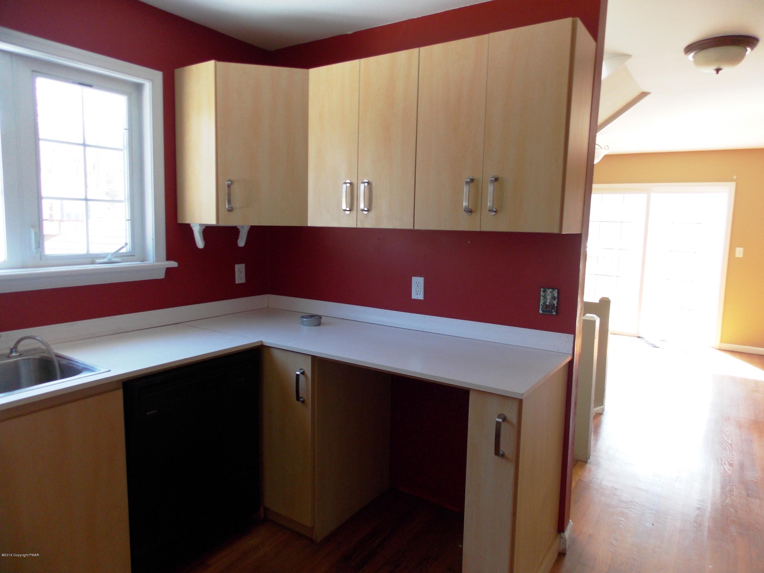 26 Lily Road East Stroudsburg, PA 18302 - Photo 34 of 48 a kitchen with a sink and a mirror