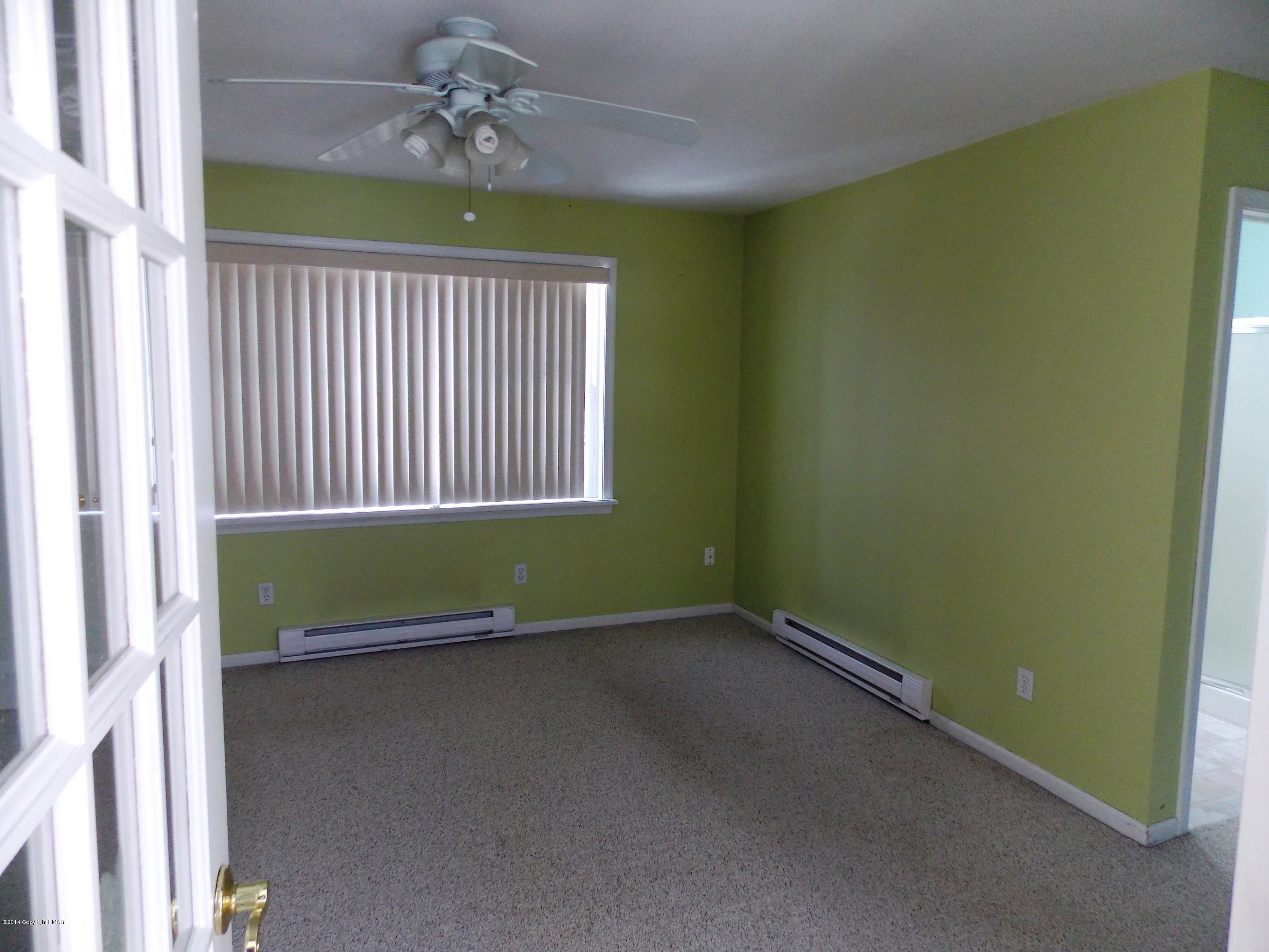 26 Lily Road East Stroudsburg, PA 18302 - Photo 36 of 48 an empty room with ceiling fan and window