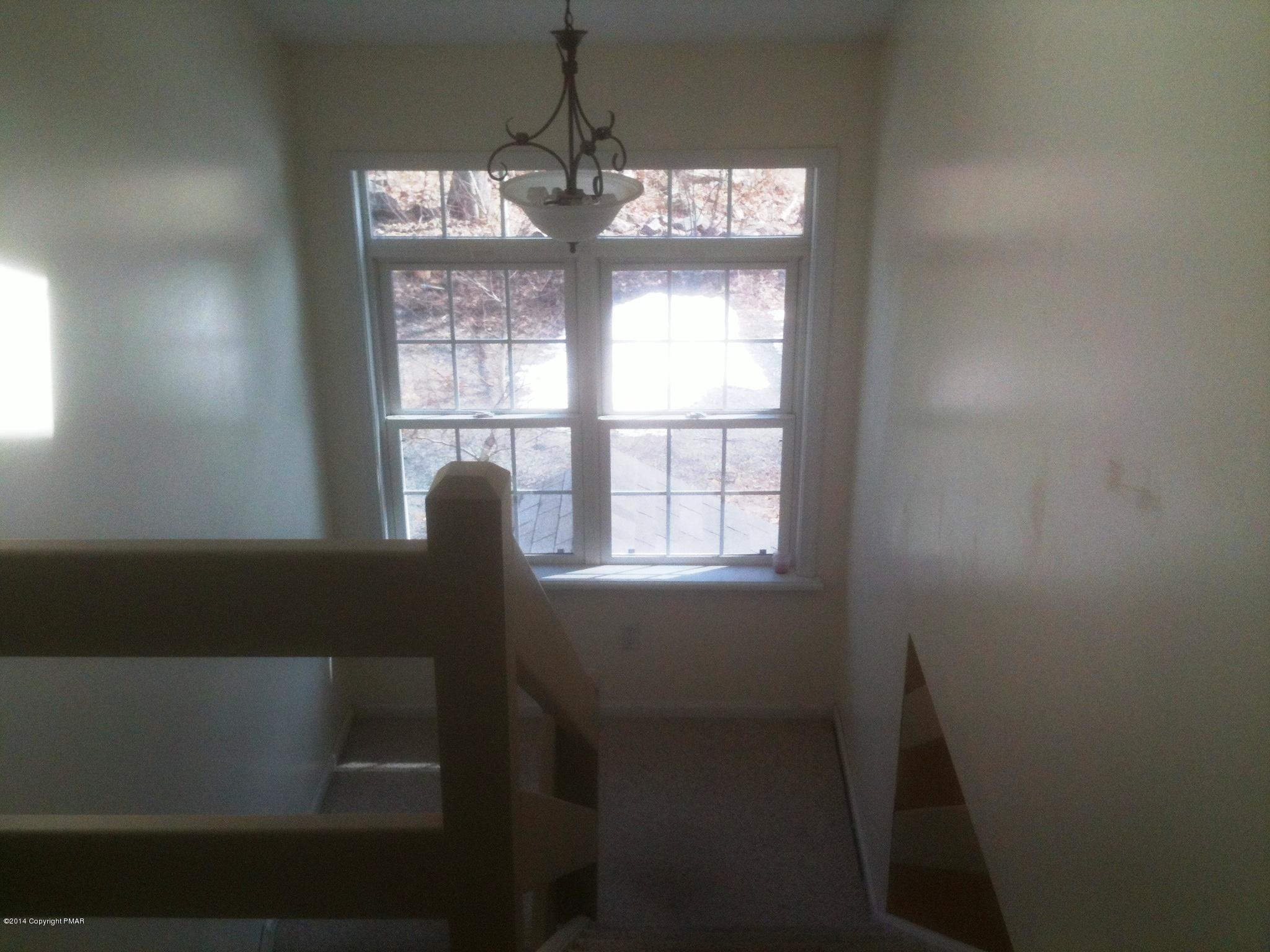 26 Lily Road East Stroudsburg, PA 18302 - Photo 4 of 48 a view of a workspace with furniture and a window