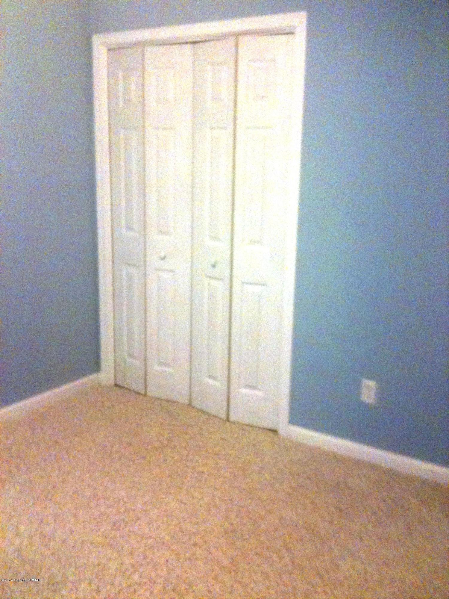 26 Lily Road East Stroudsburg, PA 18302 - Photo 9 of 48 a view of an empty room and window