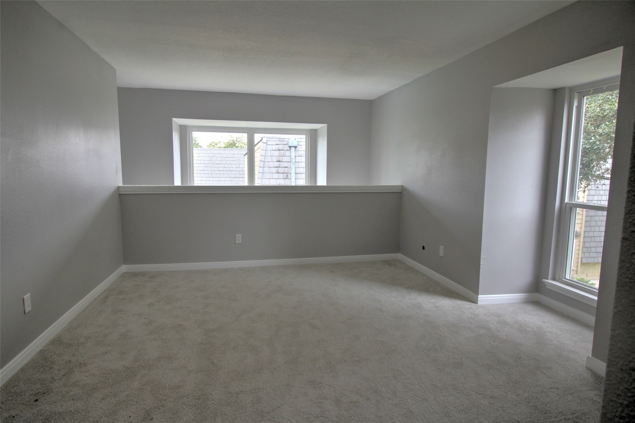 16120 Stuebner Airline Road, Unit 601 Spring, TX 77379 - Photo 3 of 12 an empty room with windows