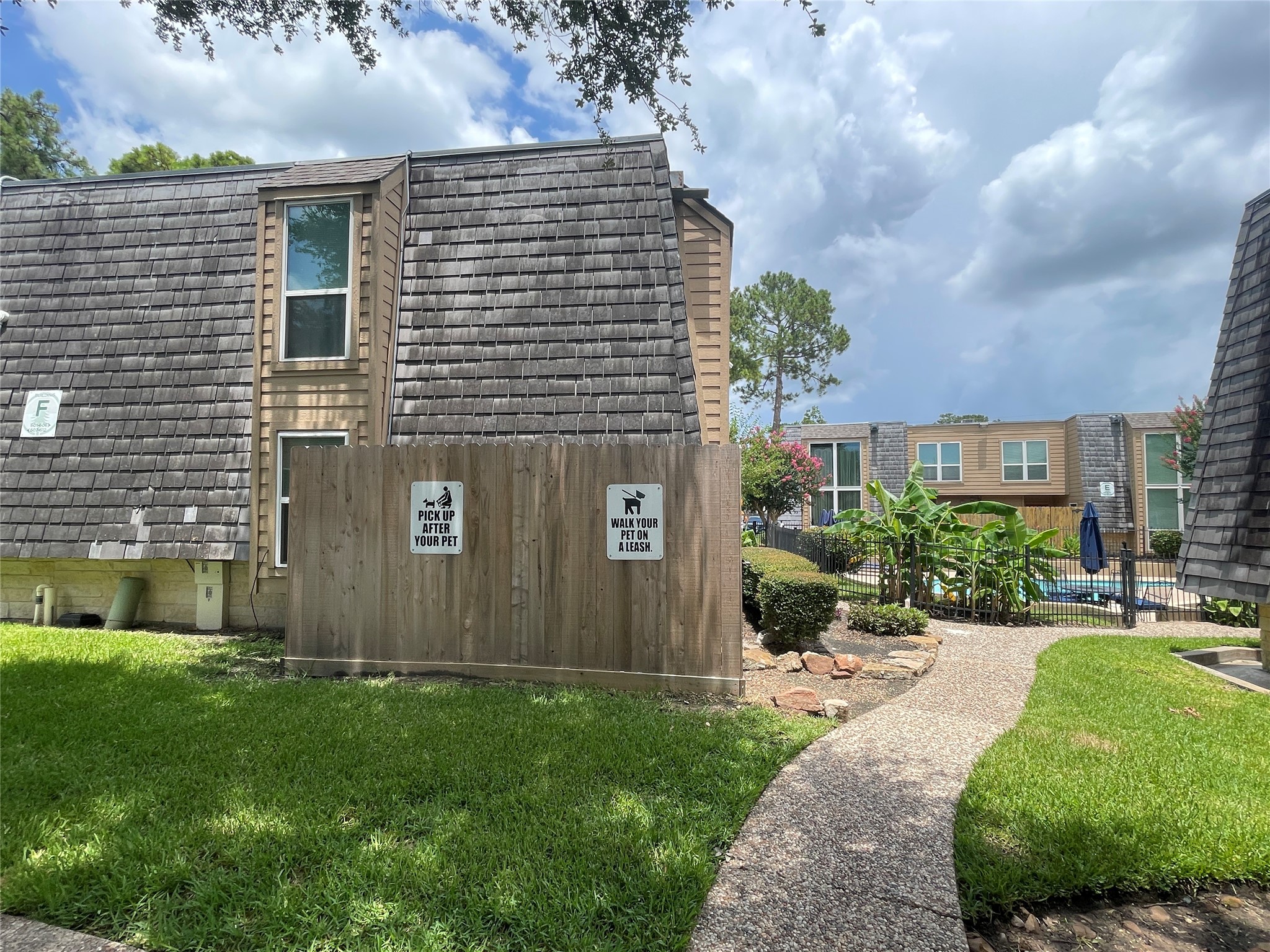 16120 Stuebner Airline Road, Unit 601 Spring, TX 77379 - Photo 9 of 12 a front view of a house with garden