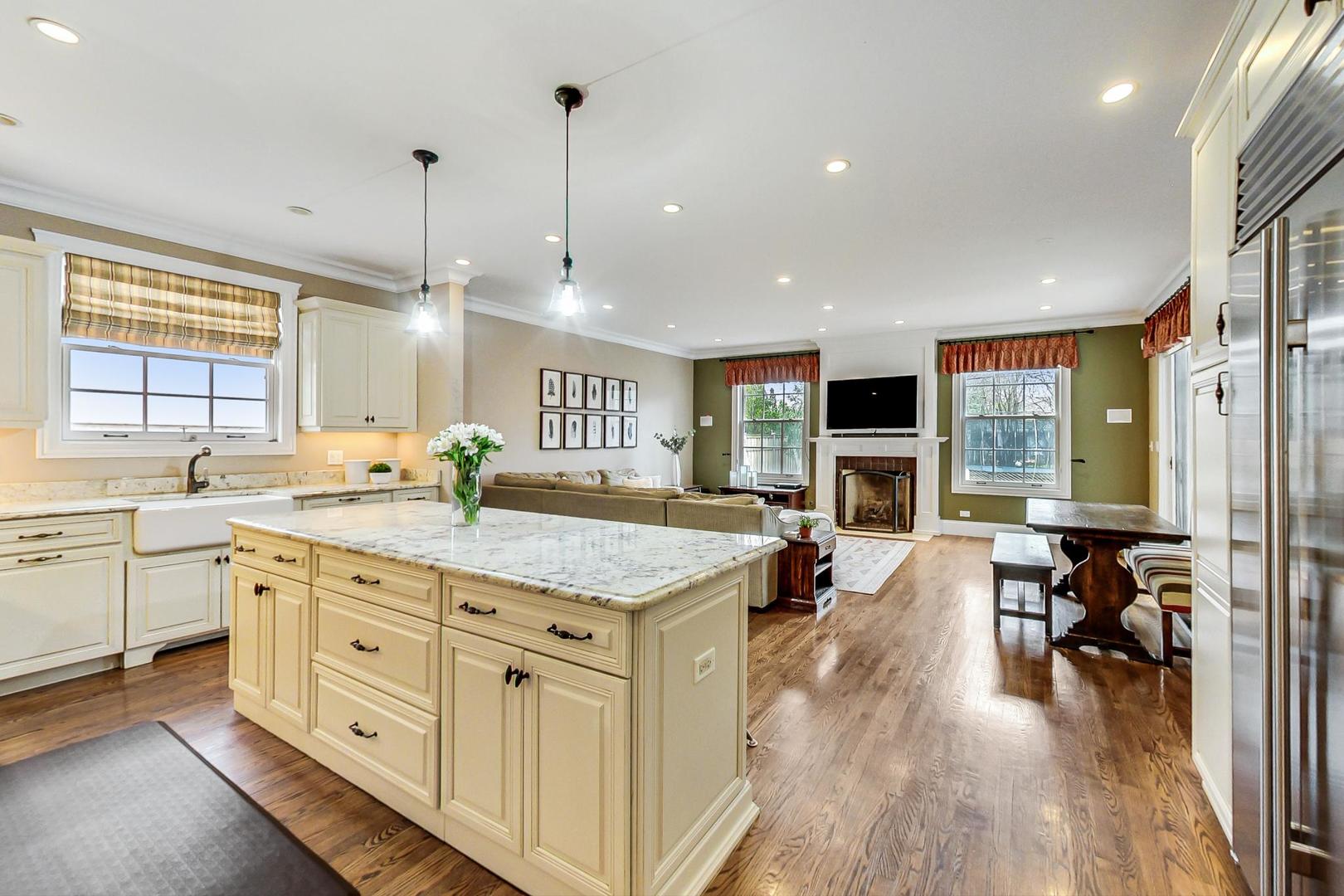 615 Windsor Road Glenview, IL 60025 - Photo 11 of 51 a spacious kitchen with stainless steel appliances granite countertop a lot of counter space and a wooden floors