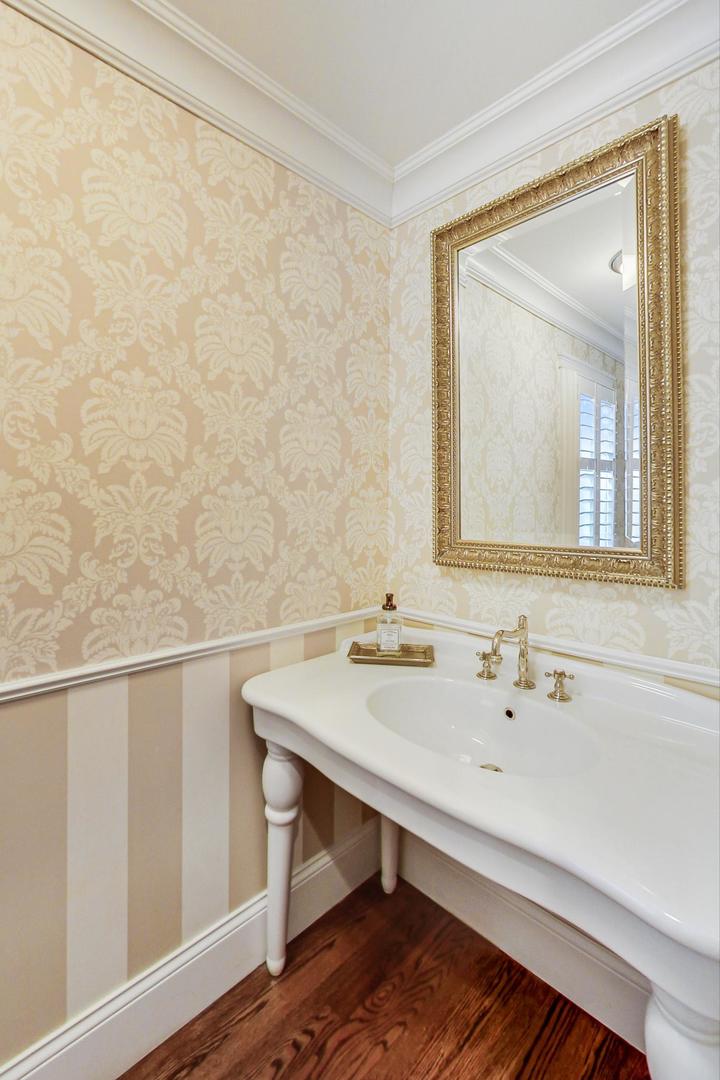 615 Windsor Road Glenview, IL 60025 - Photo 18 of 51 a bathroom with a sink and a mirror