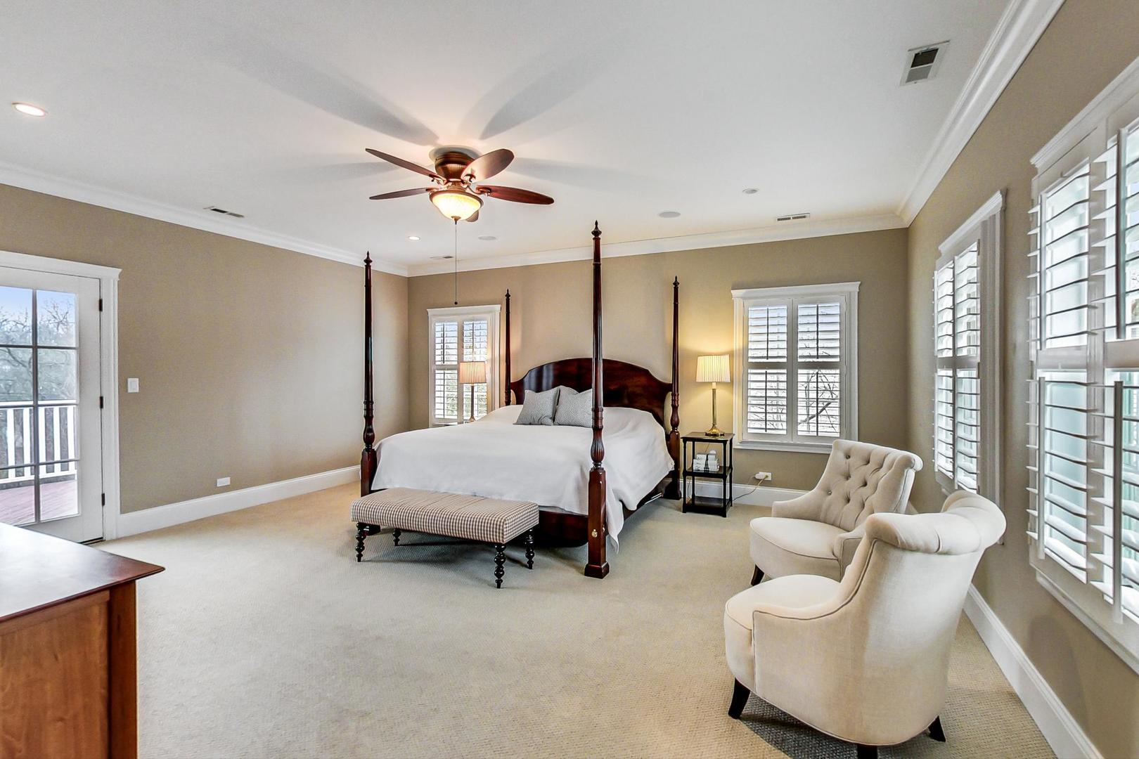 615 Windsor Road Glenview, IL 60025 - Photo 20 of 51 a spacious bedroom with a bed and a couch