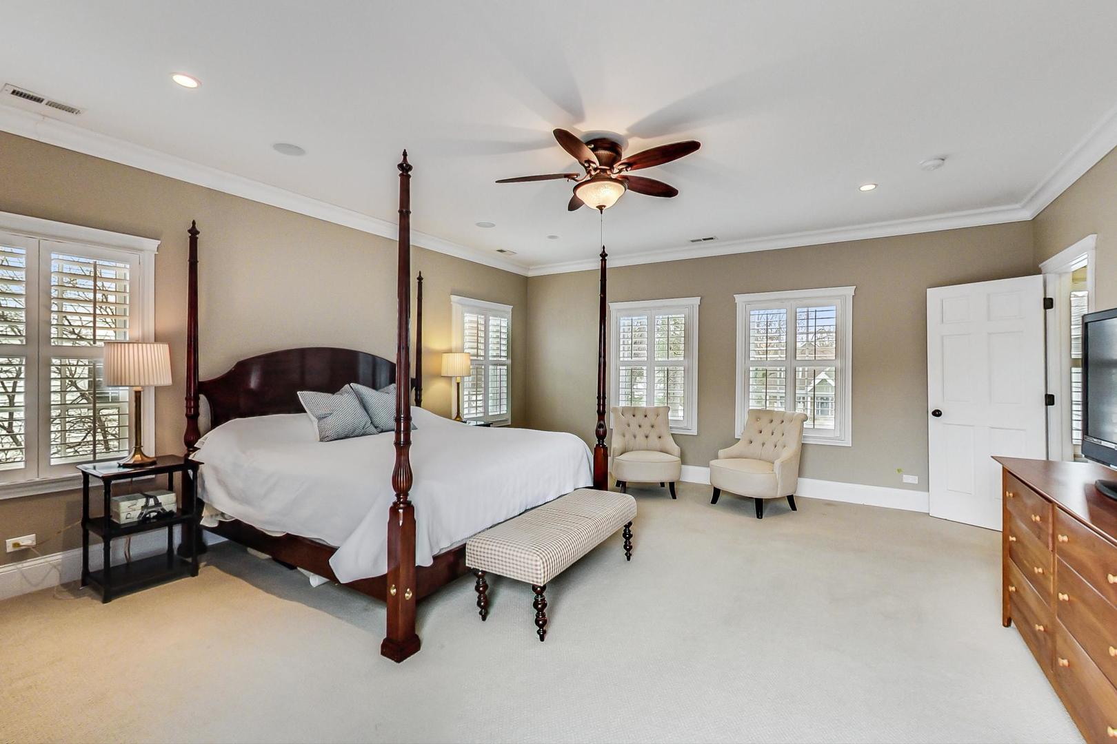 615 Windsor Road Glenview, IL 60025 - Photo 21 of 51 a spacious bedroom with a bed and large windows