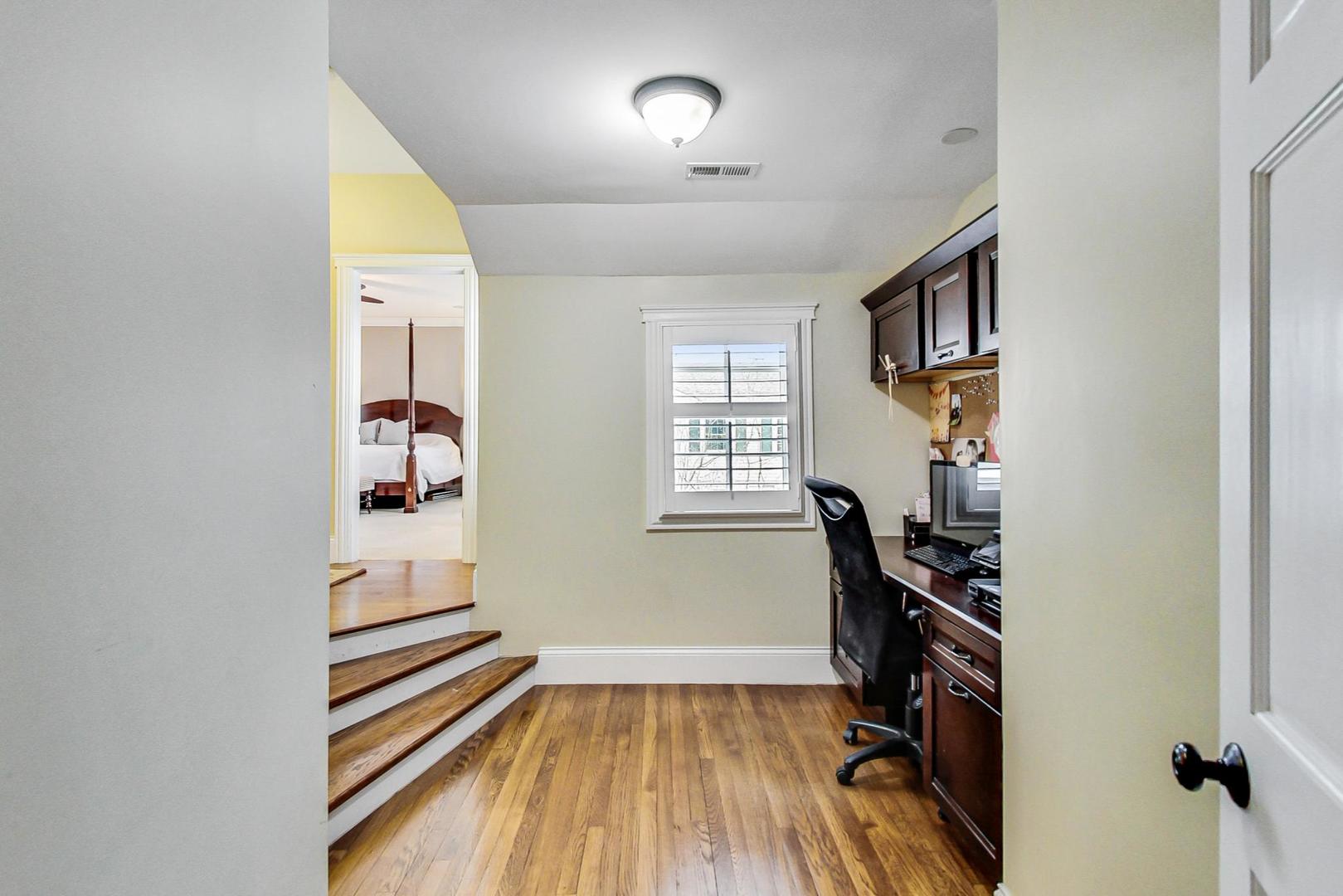 615 Windsor Road Glenview, IL 60025 - Photo 23 of 51 wooden floor in an empty room with a window