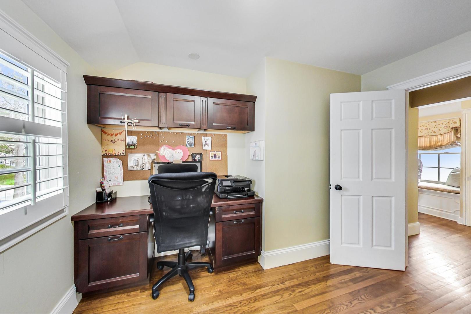 615 Windsor Road Glenview, IL 60025 - Photo 24 of 51 a view of a workspace with furniture and a window