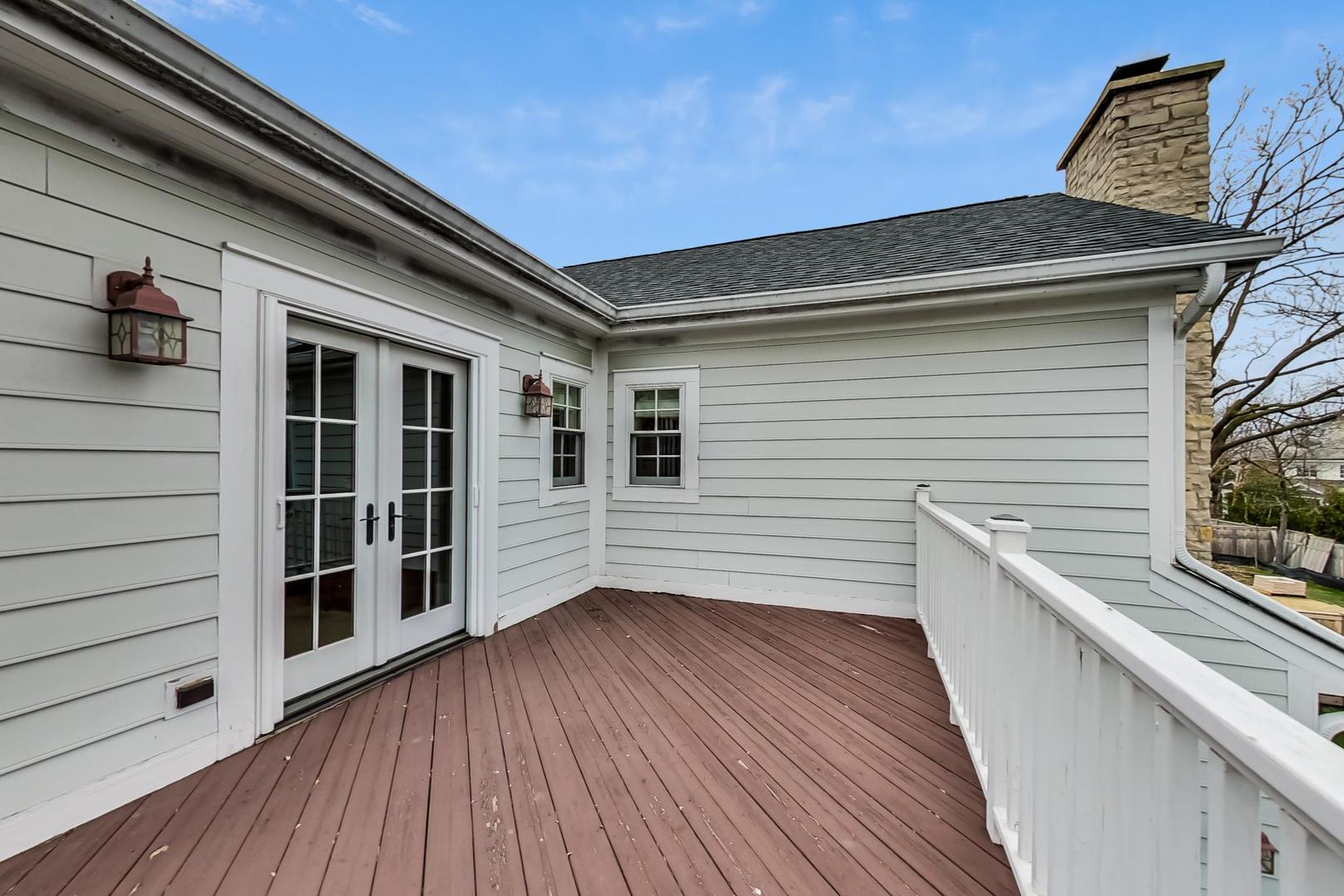 615 Windsor Road Glenview, IL 60025 - Photo 27 of 51 a view of a deck with wooden floor and fence