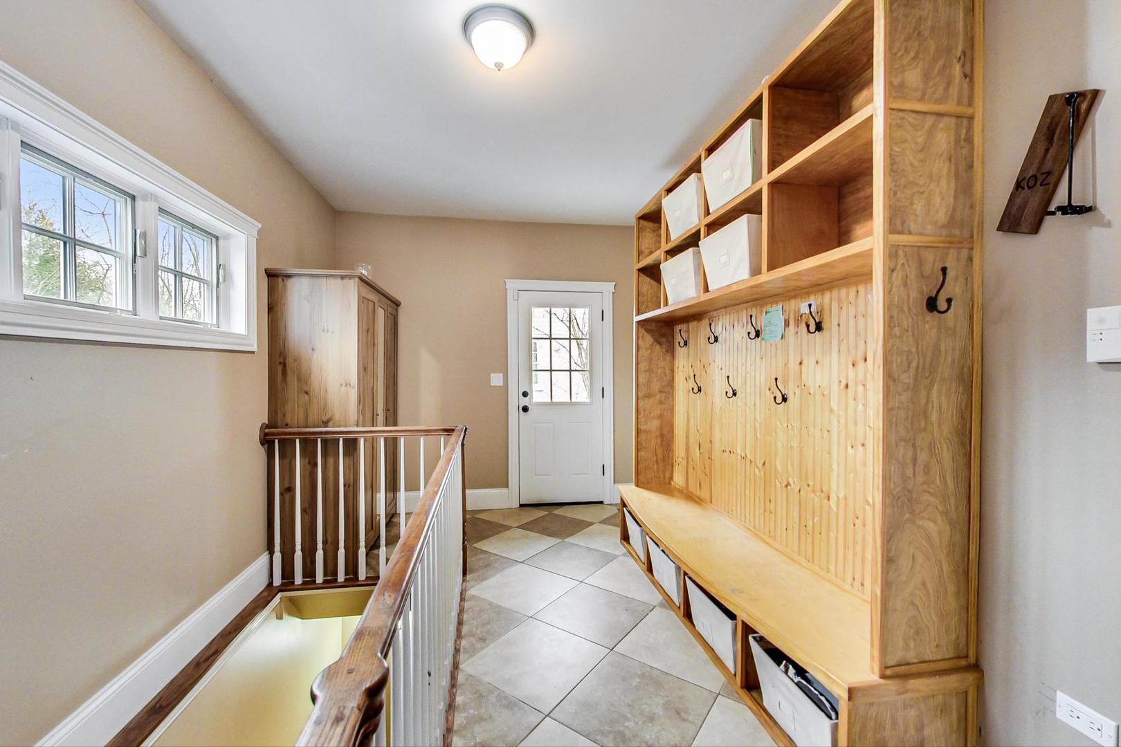 615 Windsor Road Glenview, IL 60025 - Photo 39 of 51 a view of entryway with wooden floor and stairs