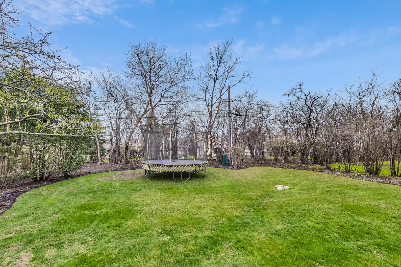 615 Windsor Road Glenview, IL 60025 - Photo 48 of 51 a view of a yard with a house in the background