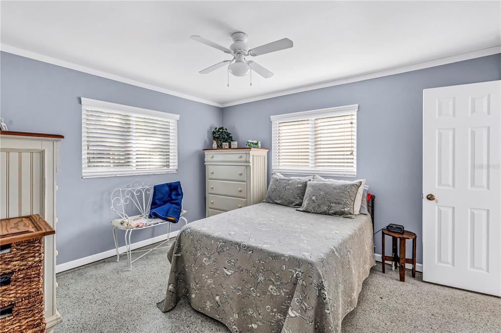 10020 Panama Court Seminole, FL 33776 - Photo 11 of 25 a bedroom with a bed and a window