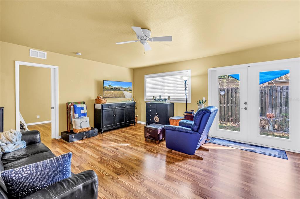 10020 Panama Court Seminole, FL 33776 - Photo 14 of 25 a living room with furniture and a flat screen tv
