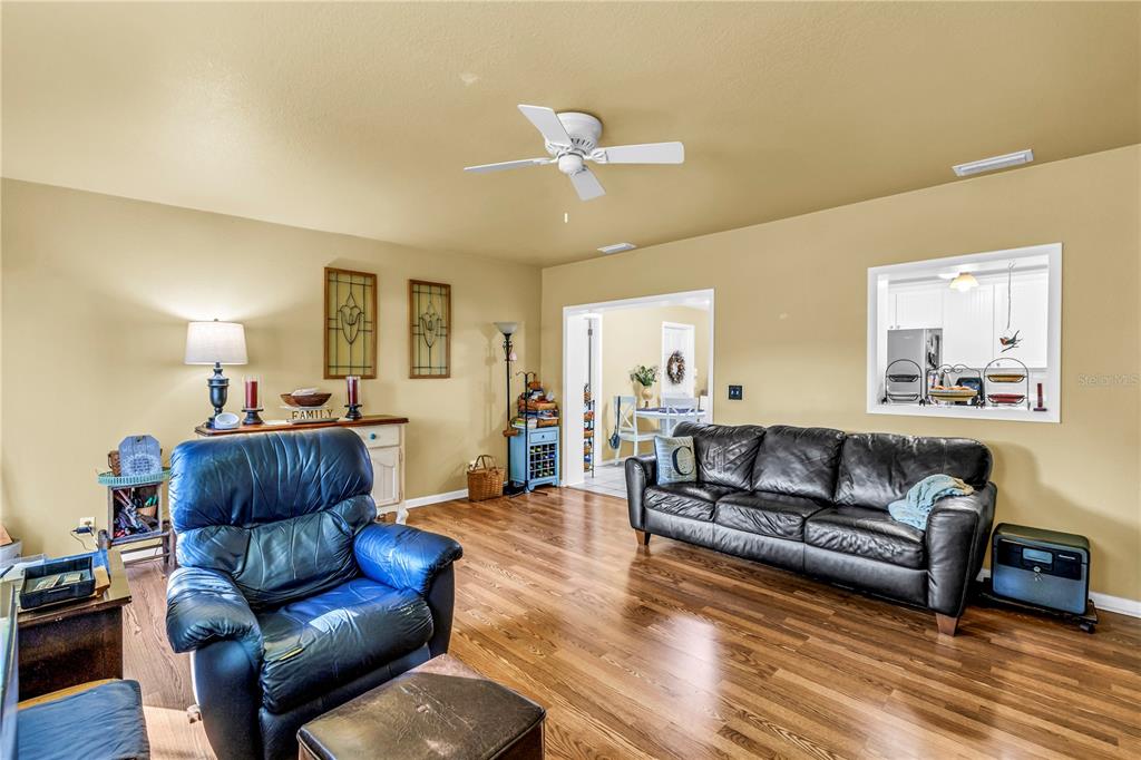 10020 Panama Court Seminole, FL 33776 - Photo 16 of 25 a living room with furniture and a wooden floor