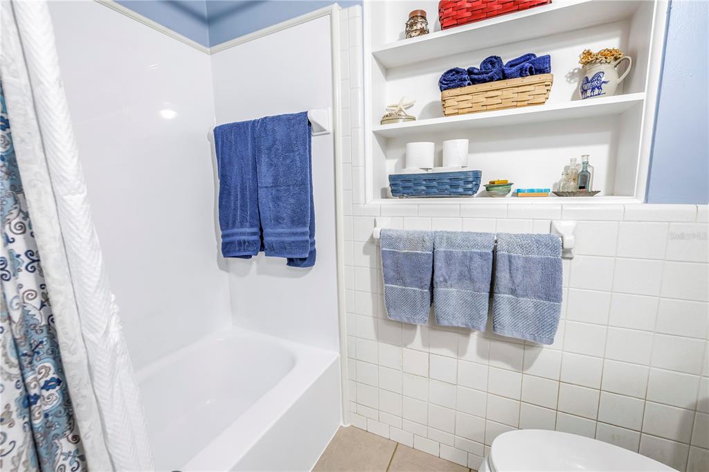 10020 Panama Court Seminole, FL 33776 - Photo 21 of 25 a bathroom with a bathtub and shower