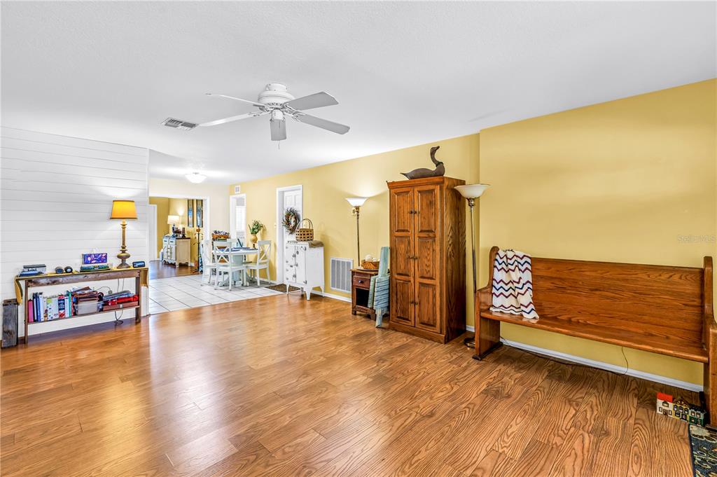 10020 Panama Court Seminole, FL 33776 - Photo 6 of 25 a view of a livingroom with furniture a ceiling fan and window