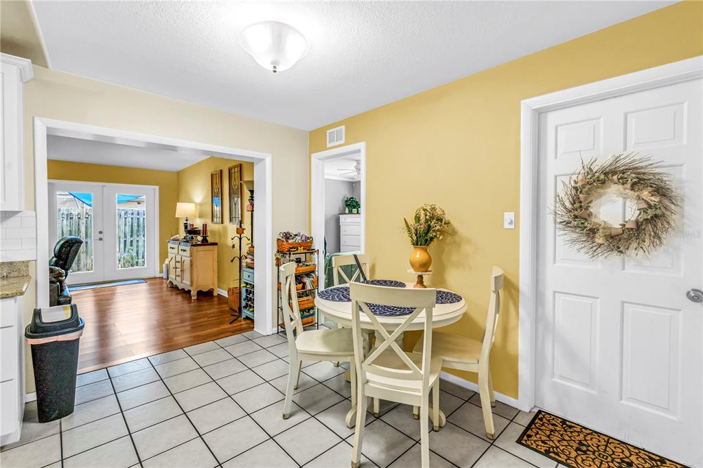 10020 Panama Court Seminole, FL 33776 - Photo 7 of 25 a dining room with furniture and wooden floor