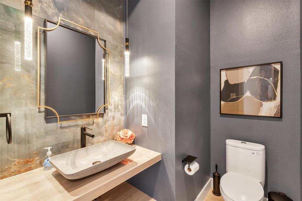 7519 Robin Road Dallas, TX 75209 - Photo 25 of 40 Bathroom featuring toilet and vanity